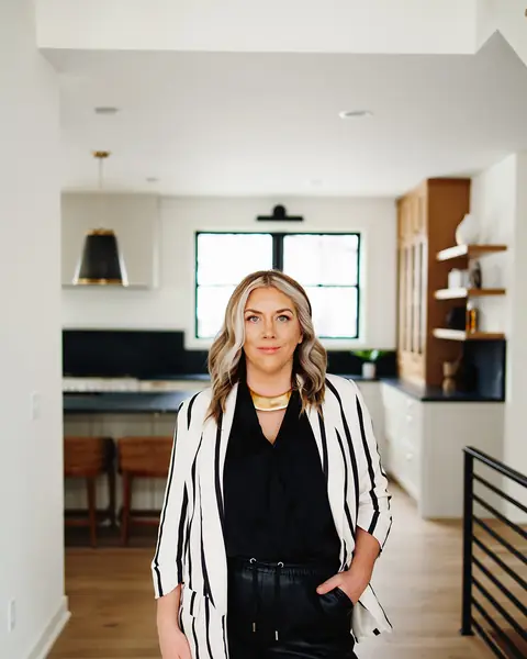 Ashlei standing in a bright kitchen